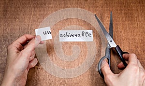 Scissors cutting negative label, self motivation concept
