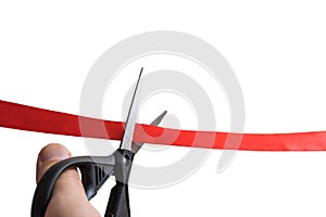 Scissors are cutting red ribbon. Opening event concept. Isolated on white background