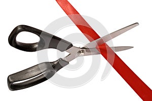 Scissors cutting red tape or ribbon,