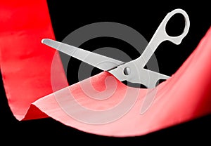 Scissors cutting ribbon