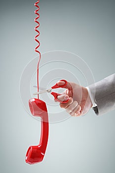 Scissors cutting telephone connection