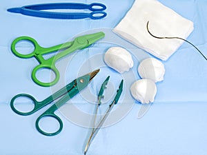 Scissors, forceps, surgical gauze, suture needle