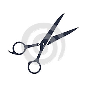 Scissors glyph icon. Haircutting shears. Cutting instrument with finger brace, tang. Hairdressing instrument. photo