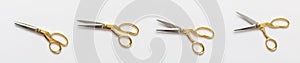 Scissors gold and silver isolated against white background