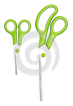 Scissors green plastic handles isolated white background. Clipping path