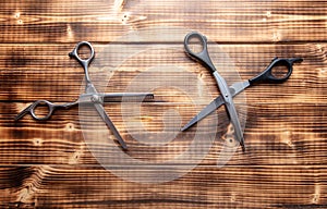 Scissors for haircuts on a wooden background