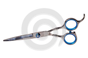 Scissors isolated. Close-up of a new professional scissors for haircuts isolated on a white background. Barbers or hairdresser