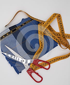 Scissors and made in Italy fabric on white background