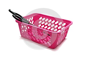 Scissors with plastic handle lie in a pink basket