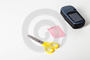 Scissors, protective film and navigator on a white background. Protection of the screen of the navigator from scratches