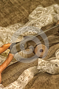 Scissors, ribbons, sewing pins, stylized image of an old