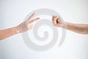 Scissors symbol and hammer symbol in playing rock paper scissors game on white background