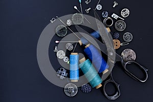 Scissors, thread and buttons. Tailoring tools and accessories