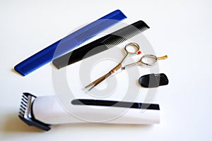 Scissors and two combs Hair clippers and comb isolated on white background