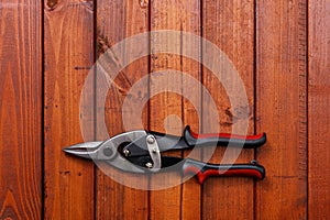 Scissors on wood background