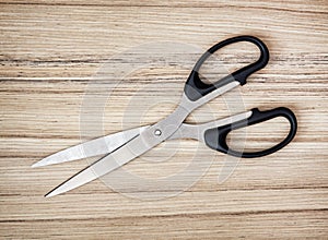 Scissors on the wooden background, office supplies