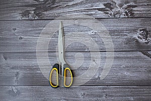 Scissors with a yellow handle closed