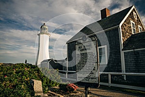 Scituate Harbor lighthouse overlooks a breakwater in Massachusetts - oct, 2022