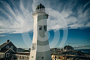 Scituate Harbor lighthouse overlooks a breakwater in Massachusetts - oct, 2022