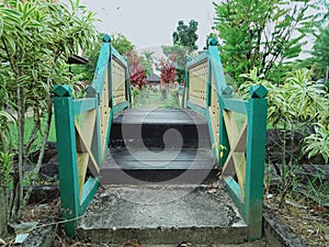 The scnery in the park of museum and the small bridges from wooden with the tree in around