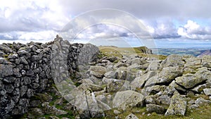 Scoat Fell summit cairn, on the wall, Lake District