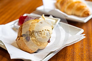 scone with cream and strawberry jam