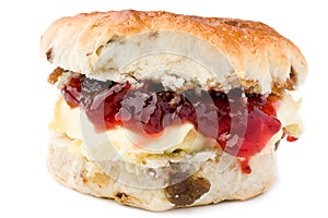 Scone with jam and clotted cream. photo