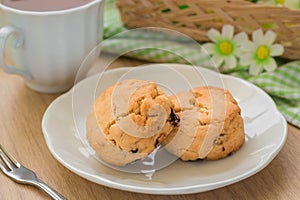 Scones on plate and cup of tea