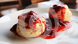 Scones with strawberry jam. Traditional English afternoon tea scones local dessert