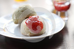 Scones tea with strawberry jam