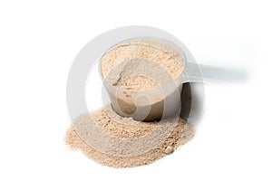 Scoop of chocolate flavour protein powder isolated