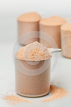 Scoop of chocolate whey isolate protein