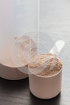 Scoop of chocolate whey isolate protein