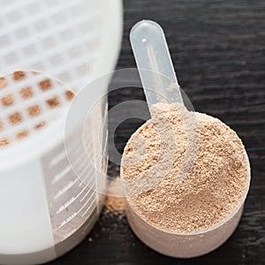 Scoop of chocolate whey isolate protein