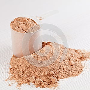 Scoop of chocolate whey isolate protein powder photo