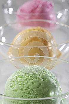 Scoop of delicious real fresh ice cream in Mango, Strawberry and Pistachio flavour.