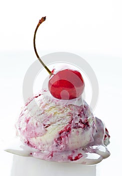 Scoop of fruit ice cream and cherry
