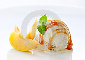 Scoop of ice cream on white plate