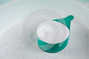 Scoop of Laundry detergent powder for washing machine