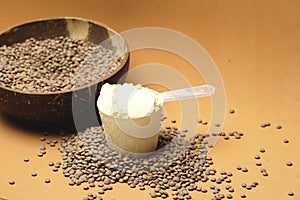 scoop of lentil flour over raw lentils. vegan cooking concept