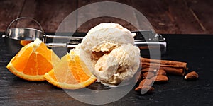 scoop of orange ice cream with almond and chocolate