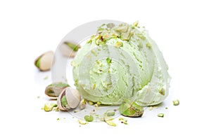 A scoop of pistachio ice cream with pistachios isolated on white background