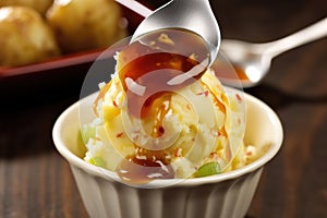 scoop of potato salad with bbq sauce drippings