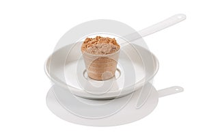 Scoop of whey protein on white background. Chocolate flawour