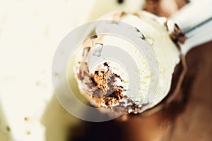 Scooped vanilla and chocolate ice cream background. Summer food concept, copy space, top view. Sweet yogurt dessert or