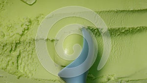 Scooping lime flavoured sherbet ice cream.