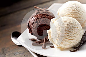 Scoops of Chocolate and Vanilla Ice Cream on Plate photo