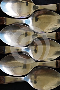 Scoops with concave heads in polished steel