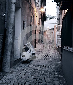 Scooter in alleyway photo