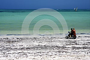 scooter in the beach of zanzibar photo